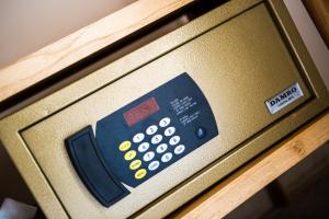 a remote control on the side of a microwave oven at The Spice Trail in Arugam Bay