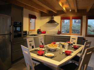 a kitchen with a table with food on it at La maison de Marie in Valmorel