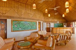 a living room with chairs and a couch at Thulhagiri Island Resort & Spa in North Male Atoll +37 photos