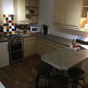 
A kitchen or kitchenette at In House Garden Flat
