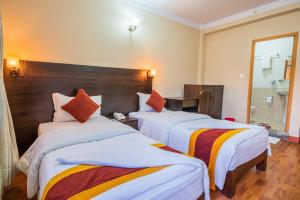 Voodi või voodid majutusasutuse Kathmandu Sunny Hotel toas
