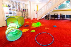 a childs room with a play room with a staircase at Hotel Horní Pramen in Špindlerův Mlýn