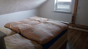 מיטה או מיטות בחדר ב-Ubytovanie na Spiši