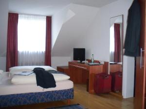 Postel nebo postele na pokoji v ubytování Hotel Lutter