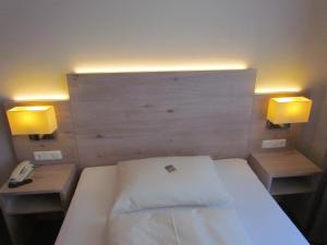 Postel nebo postele na pokoji v ubytování Hotel Lutter