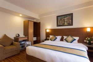 Letto o letti in una camera di Oasis Kathmandu Hotel