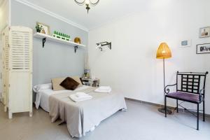 Łóżko lub łóżka w pokoju w obiekcie Apartamento