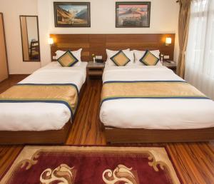 Letto o letti in una camera di Oasis Kathmandu Hotel