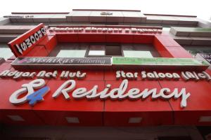 a red building with a sign for a star salad restaurant at S4 Residency in Chennai