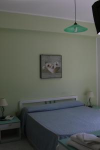 Postel nebo postele na pokoji v ubytování Palia's Hotel