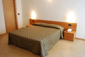 Postel nebo postele na pokoji v ubytování Albergo Ristorante Orazio