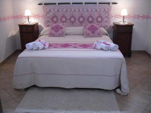 A bed or beds in a room at Nonna Murtas