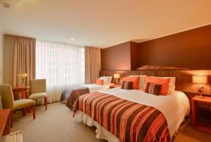 Rúm í herbergi á Hotel Terraza Suite