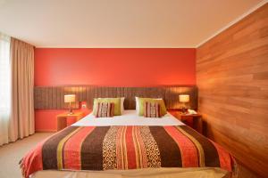 Rúm í herbergi á Hotel Terraza Suite