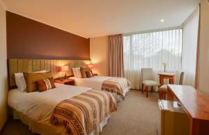 Rúm í herbergi á Hotel Terraza Suite