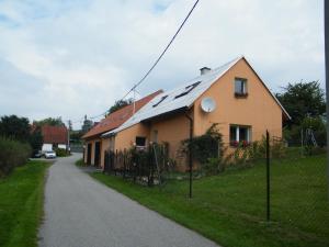 a house with solar panels on the roof at U Slunce in Ostředek