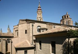 an old building with a tower on top of it at Dean Dos Catedrales in Zaragoza