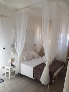 Postel nebo postele na pokoji v ubytování B&B Albaluna