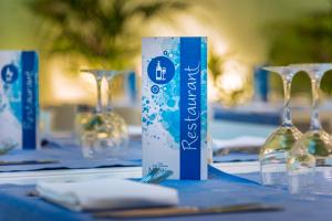 a table with wine glasses and a can on it at Hotel Montemar Maritim in Santa Susanna +93 photos