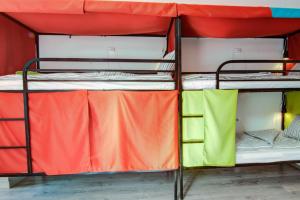 a group of bunk beds in a dorm room at Pal's Mini Hostel in Budapest