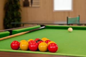 a group of balls on a pool table at Laguna Hotel in Bournemouth