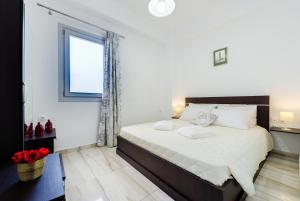 Postel nebo postele na pokoji v ubytování Sun View Villas