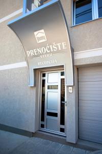 a entrance to a building with a garage at Guesthouse Vitez in Vranje