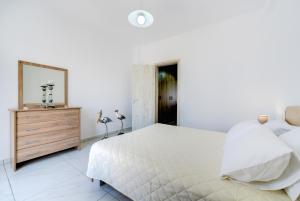 Postel nebo postele na pokoji v ubytování Sun View Villas