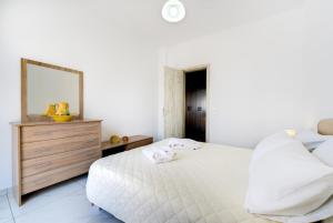 Postel nebo postele na pokoji v ubytování Sun View Villas