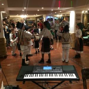 a group of children dressed in costumes standing around a keyboard at Complex Padina Ursului Fundata in Fundata +125 photos