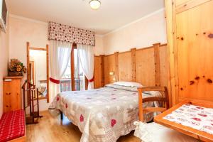 Postel nebo postele na pokoji v ubytování Albergo Adele