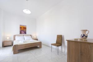 Postel nebo postele na pokoji v ubytování Sun View Villas