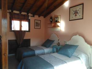 Postel nebo postele na pokoji v ubytování Castillo Alto
