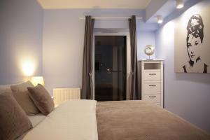 En eller flere senge i et værelse på Super-Apartamenty VIP Vintage