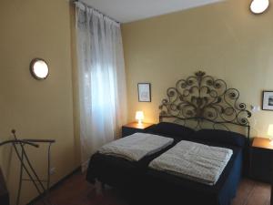 En eller flere senger på et rom på Casa Domenica