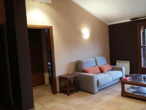 a living room with a couch and a table at Hospedería Prepirineo in Undués-Pintano