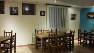 a dining room with a table and chairs at Hospedería Prepirineo in Undués-Pintano