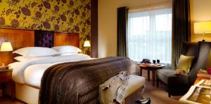 Ένα ή περισσότερα κρεβάτια σε δωμάτιο στο Brook Lane Hotel