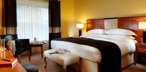 Ένα ή περισσότερα κρεβάτια σε δωμάτιο στο Brook Lane Hotel