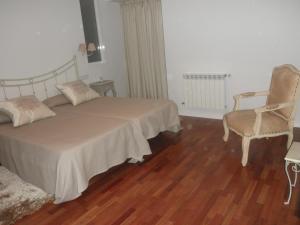 מיטה או מיטות בחדר ב-Hostal Doña Blanca