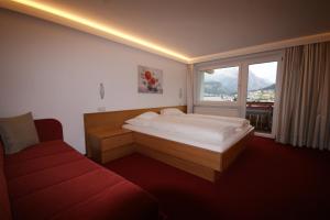 En eller flere senge i et værelse på Soldanella