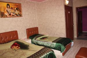 Katil atau katil-katil dalam bilik di Hotel Uyut on Rudnevka