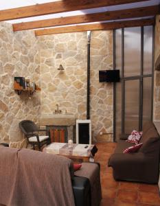 a living room with a couch and a table at El Teñao in Navamorisca