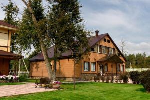 a house with a bench in front of it at Hotel Complex Park hotel D-grad in Dimitrovgrad