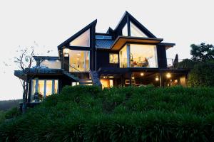 a house sitting on top of a hill at Acacia Cliffs Lodge in Taupo