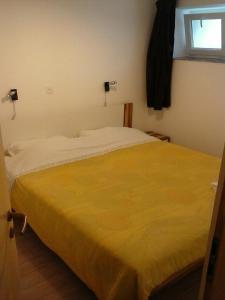 Postel nebo postele na pokoji v ubytování Apartmani Marić
