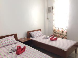 Postel nebo postele na pokoji v ubytování Brielles Travellers Inn