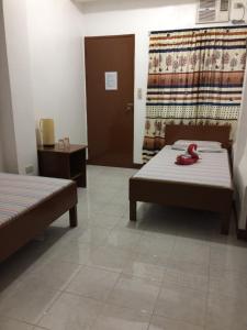 Postel nebo postele na pokoji v ubytování Brielles Travellers Inn