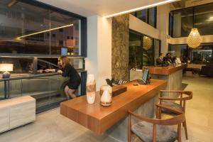 a man standing at a counter in a restaurant at Jinhold Hotel & Serviced Apartment in Miri +52 photos