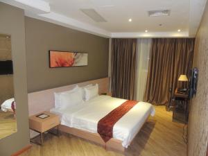 Postel nebo postele na pokoji v ubytování Dela Chambre Hotel